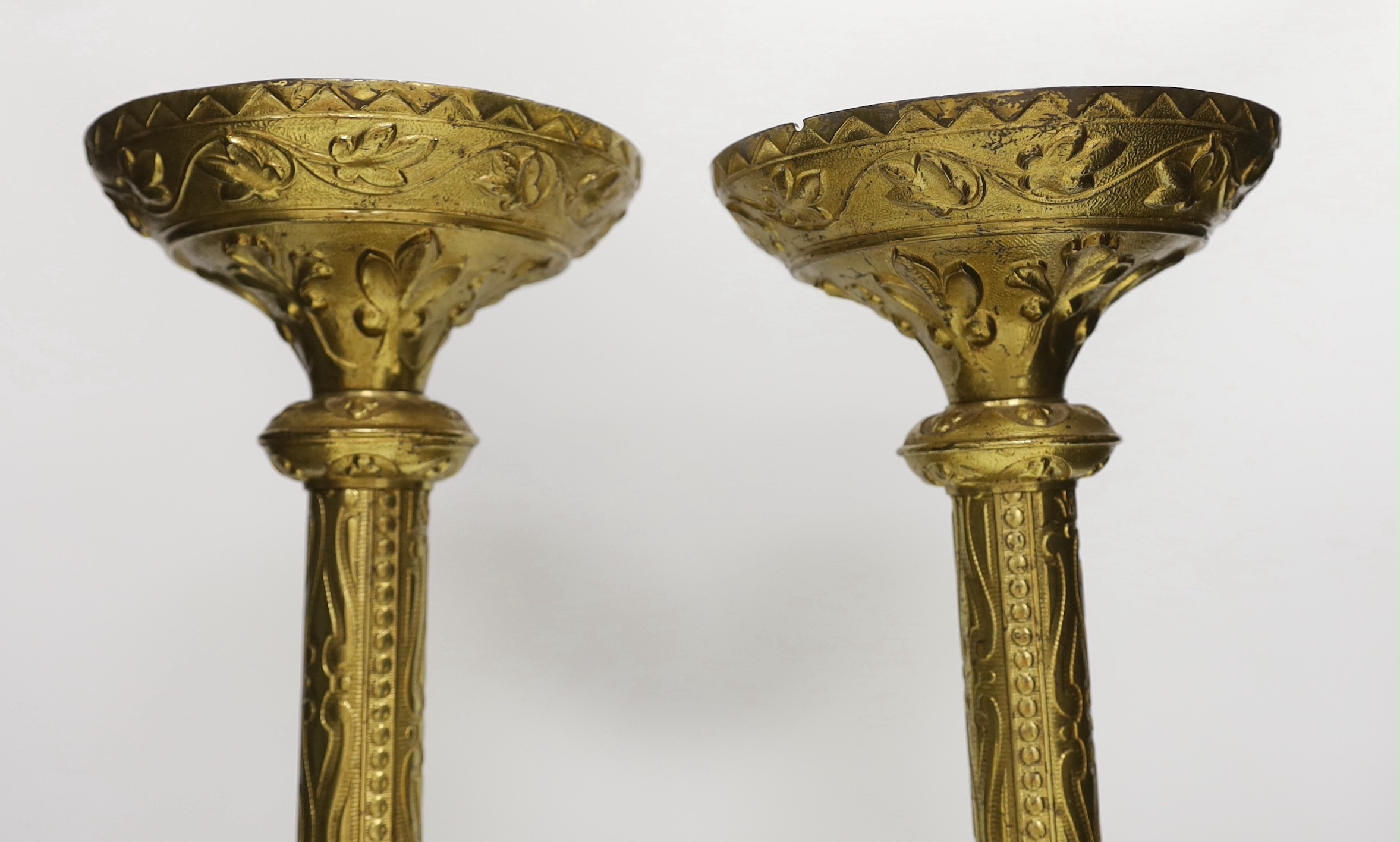 A pair of tall Victorian ecclesiastical brass candlestands, 51cms high